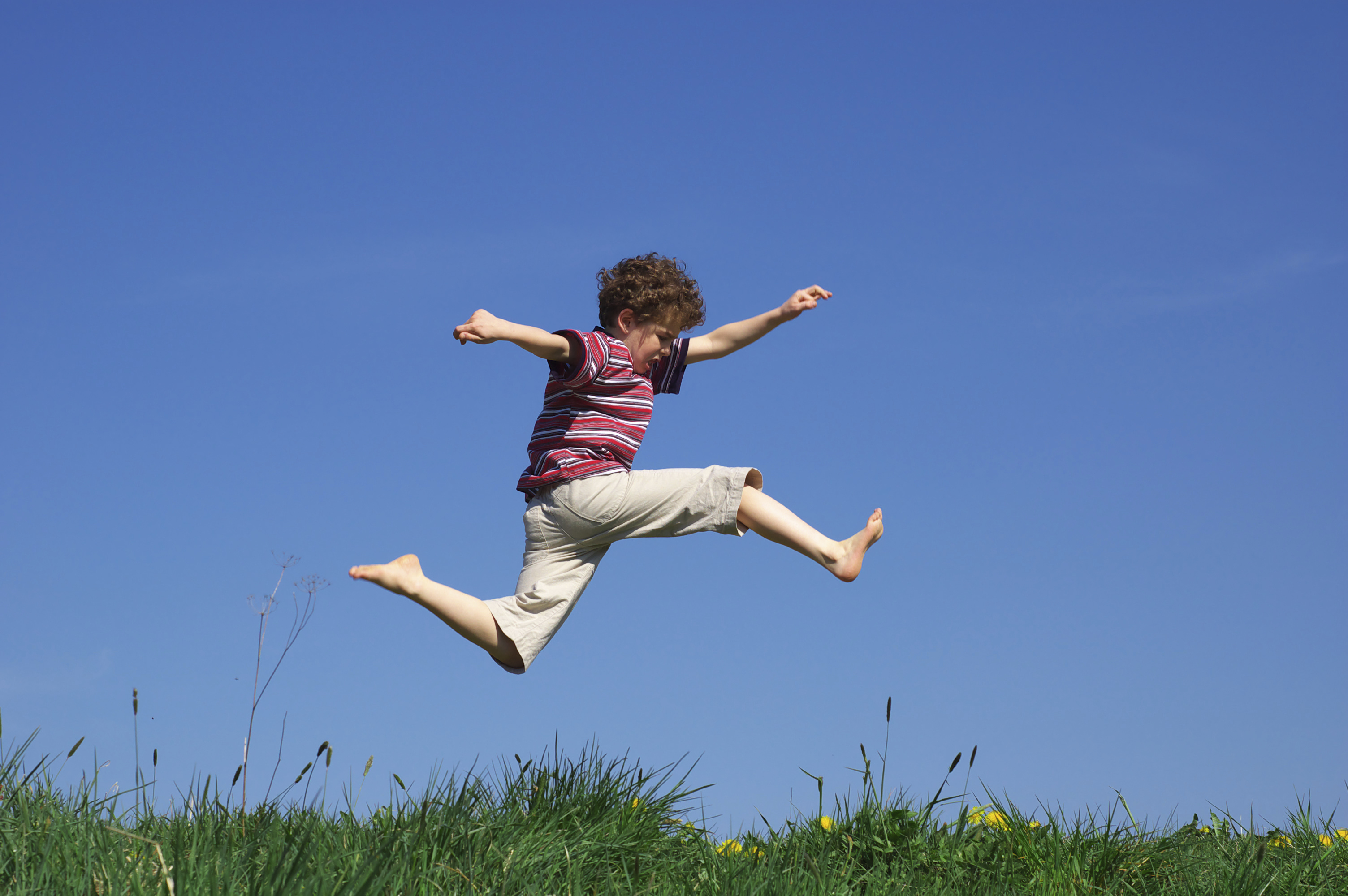 child-leaping-through-meadow-1